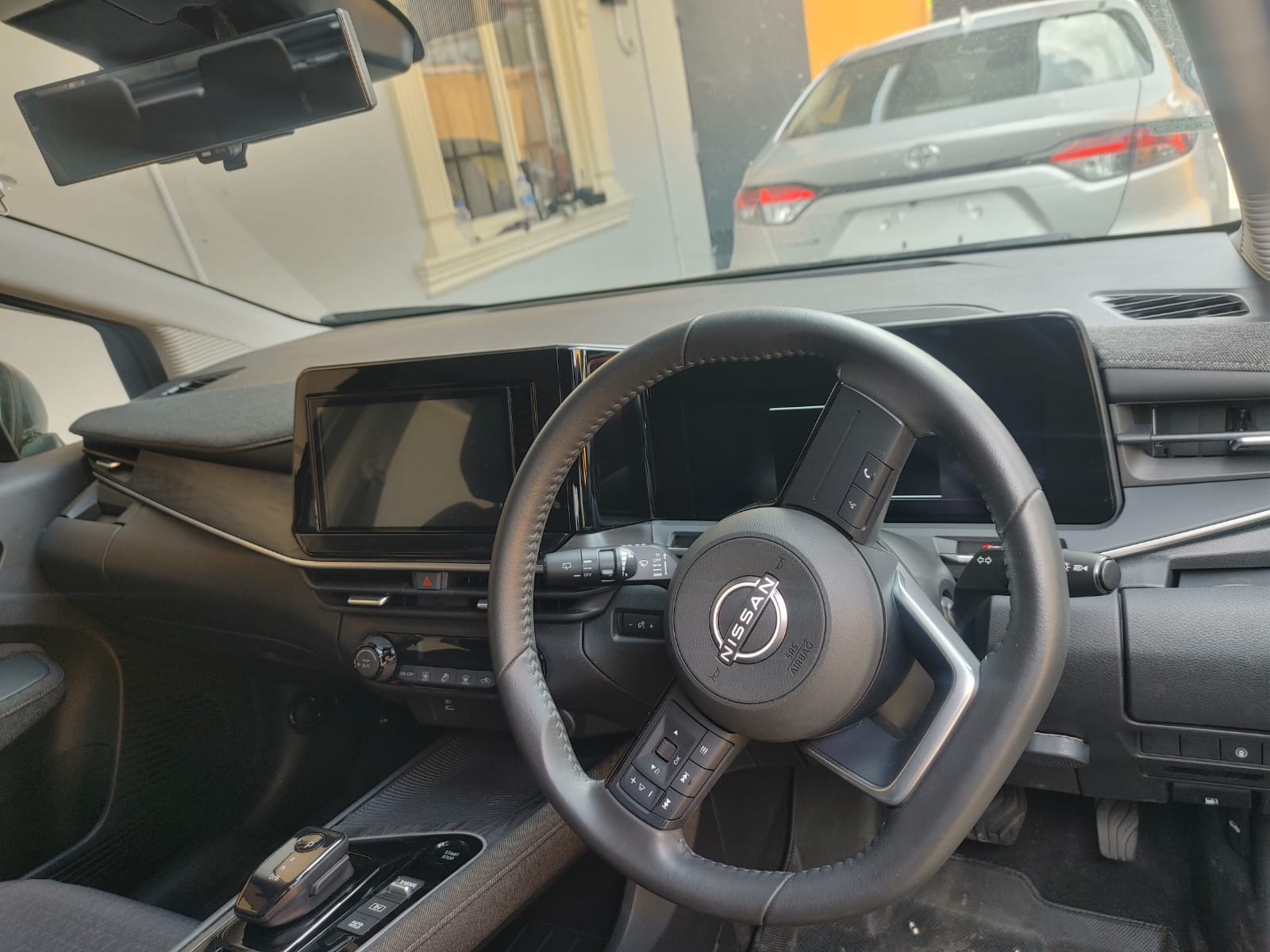 2025 Black Nissan Aura